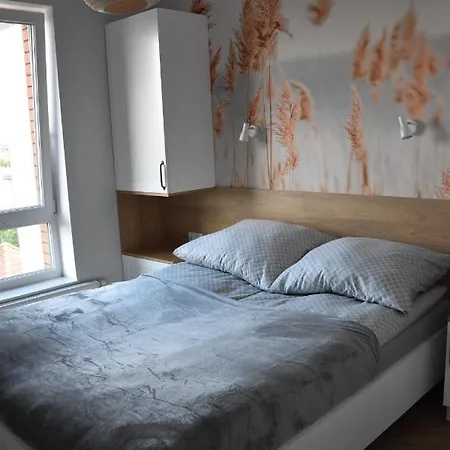 Pod Zegarem Apartmán *